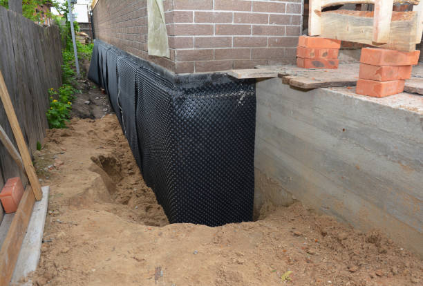 SJ Waterproofing Pros technician performing targeted Basement Waterproofing assessment in Munroe Falls, OH